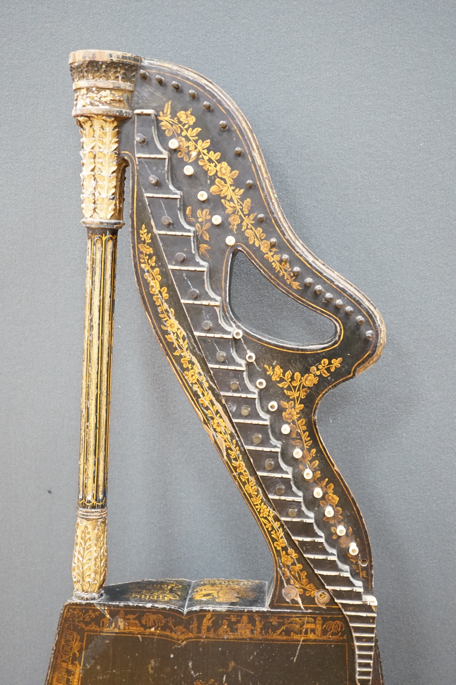 A Georgian parcel gilt and ebonised harp-lute by Edward Light, with fluted pillar, Royal coat of arms above patent number and ‘Light, Toley Place, London’, buttons to reverse with note letters, 88.5cm high CITES Submissi